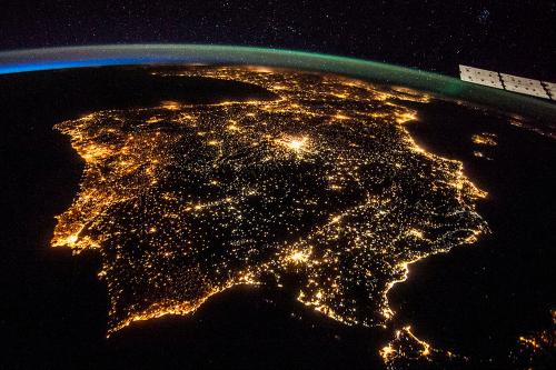 The Iberian Peninsula at night, showing Spain and Portugal, is seen in an undated NASA handout picture taken from the International Space Station. Madrid is the bright spot just above the center. The clarity of the night image is possible thanks to the European Space Agency's NightPod, installed on the station in 2012, according to a NASA news release. It incorporates a motorized tripod that compensates for the station's speed of approximately 17,500 mph and the motion of the Earth below. REUTERS/NASA/Handout via Reuters (OUTER SPACE - Tags: SCIENCE TECHNOLOGY) ATTENTION EDITORS - THIS PICTURE WAS PROVIDED BY A THIRD PARTY. REUTERS IS UNABLE TO INDEPENDENTLY VERIFY THE AUTHENTICITY, CONTENT, LOCATION OR DATE OF THIS IMAGE. THIS PICTURE IS DISTRIBUTED EXACTLY AS RECEIVED BY REUTERS, AS A SERVICE TO CLIENTS. FOR EDITORIAL USE ONLY. NOT FOR SALE FOR MARKETING OR ADVERTISING CAMPAIGNS