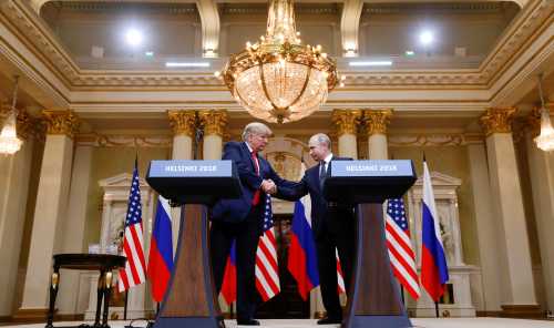 U.S. President Donald Trump and Russia's President Vladimir Putin shake hands during a joint news conference after their meeting in Helsinki, Finland, July 16, 2018. REUTERS/Kevin Lamarque     TPX IMAGES OF THE DAY