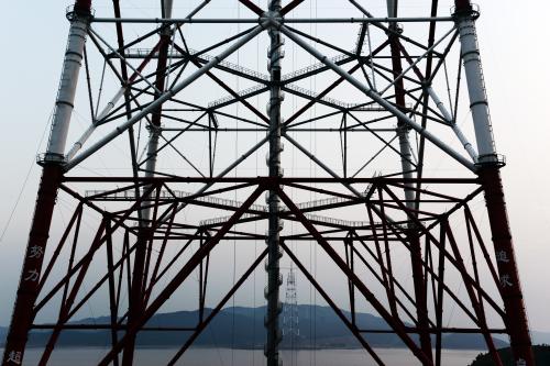 The 380-metre tall electricity pylon to carry power cables between Zhoushan's Jintang and Cezi islands with a distance of 2,656 metres, which is the tallest power transmission tower in the world, is being capped at the construction site in Cezi islands, Zhoushan city, east China's Zhejiang province, 11 August 2018.Construction on a giant power supply pylon, believed to be the world's tallest, completed in east China's Zhejiang Province, State Grid Zhejiang Electric Power Company announced. At an impressive 380 meters tall, the pylon is four times the height of London's Big Ben. The pylon will carry power cables between Zhoushan's Jintang and Cezi islands, a distance of 2,656 meters, It breaks the world record for the tallest power pylon currently held by China's Damaoshan pylon which stands at 370 meters, also in Zhoushan. The new pylon is a part of a new ultra-high voltage power line project between cities of Zhoushan and Ningbo. The project is expected to be put into use in 2019.No Use China. No Use France.