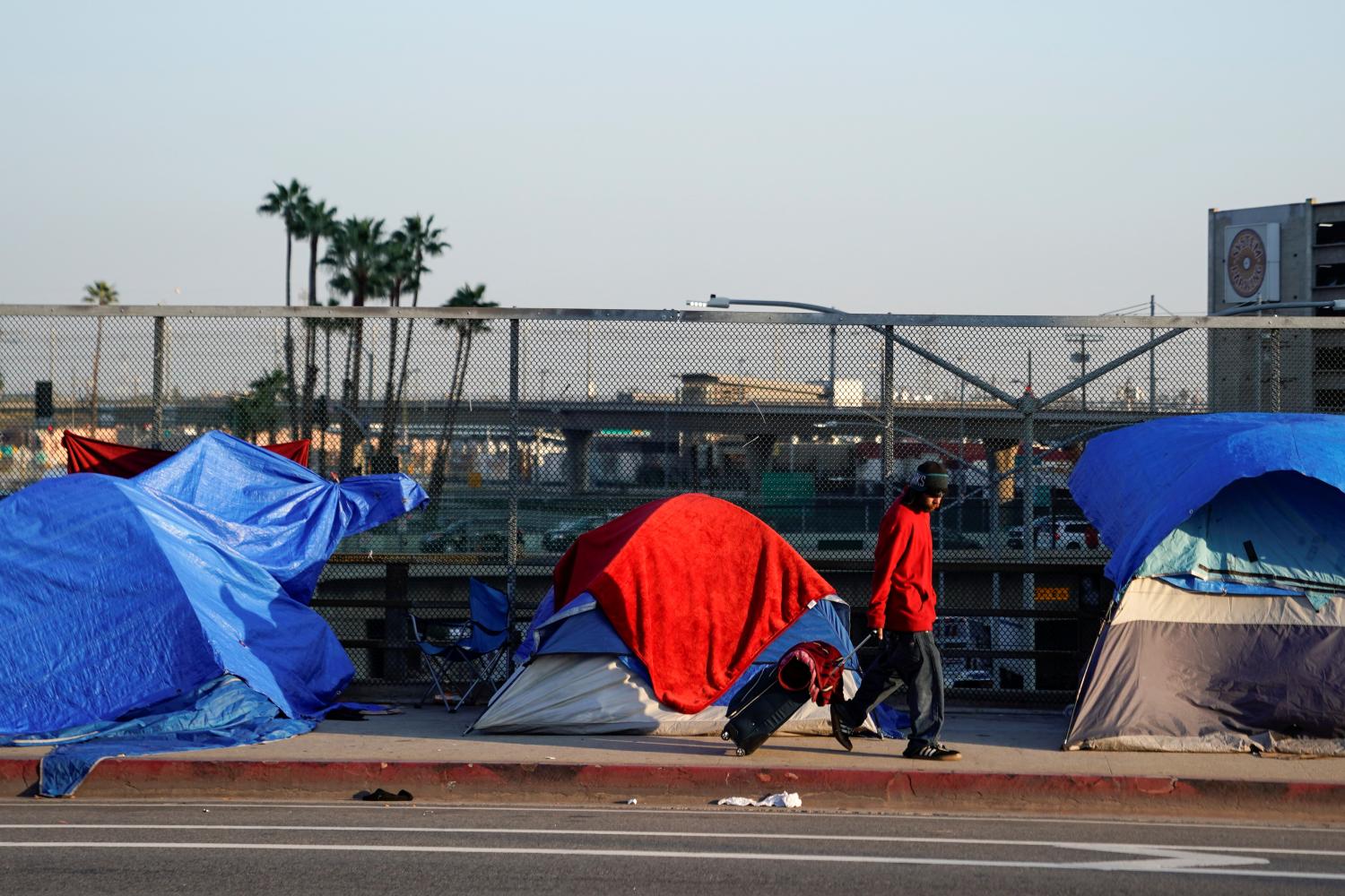 Tents and tarps are shown on the sidewalk of a freeway overpass home to hundreds of homeless living on the streets of Los Angeles, California, U.S., January 22, 2020.     REUTERS/Mike Blake