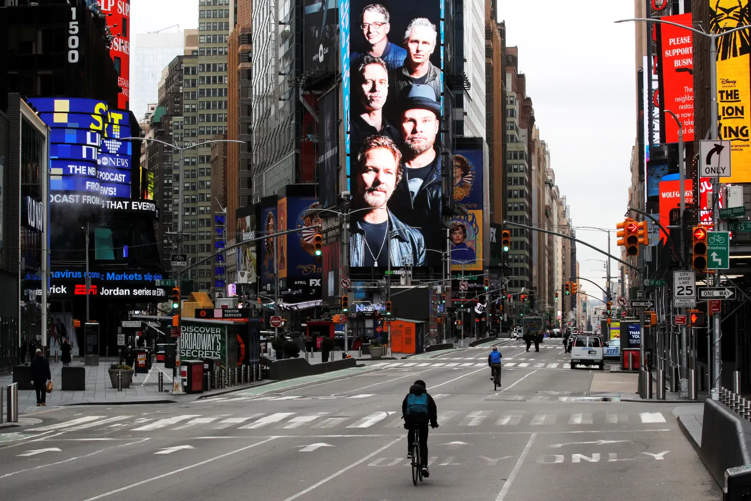 FILE PHOTO: Cyclists ride through a nearly empty Times Square in Manhattan during the coronavirus disease (COVID-19) outbreak in the Brooklyn borough of New York City, New York, U.S., March 31, 2020. REUTERS/Brendan Mcdermid/File Photo