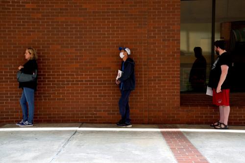 People who lost their jobs wait in line to file for unemployment following an outbreak of the coronavirus disease (COVID-19), at an Arkansas Workforce Center in Fort Smith, Arkansas, U.S. April 6, 2020. REUTERS/Nick Oxford