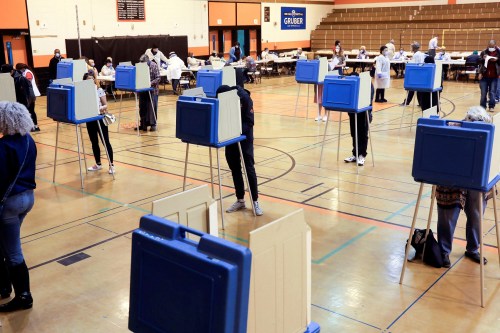 Voters fill out ballots at Riverside University High School during the presidential primary election, held amid the coronavirus disease (COVID-19) outbreak, in Milwaukee, Wisconsin, U.S., April 7, 2020. REUTERS/Daniel Acker