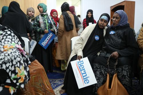 Caucus participant Sophia Egal, center right, holds a sign for presidential candidate Sen. Bernie Sanders before caucusing at the Muslim Community Organization Monday, Feb. 3, 2020, in Des Moines. (John J. Kim/Chicago Tribune/TNS/ABACAPRESS.COM)