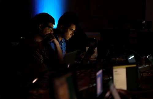 Andrew Beard (L) and Barrett Darnell compete in a contest during the Def Con hacker convention in Las Vegas, Nevada, U.S. on July 29, 2017. REUTERS/Steve Marcus