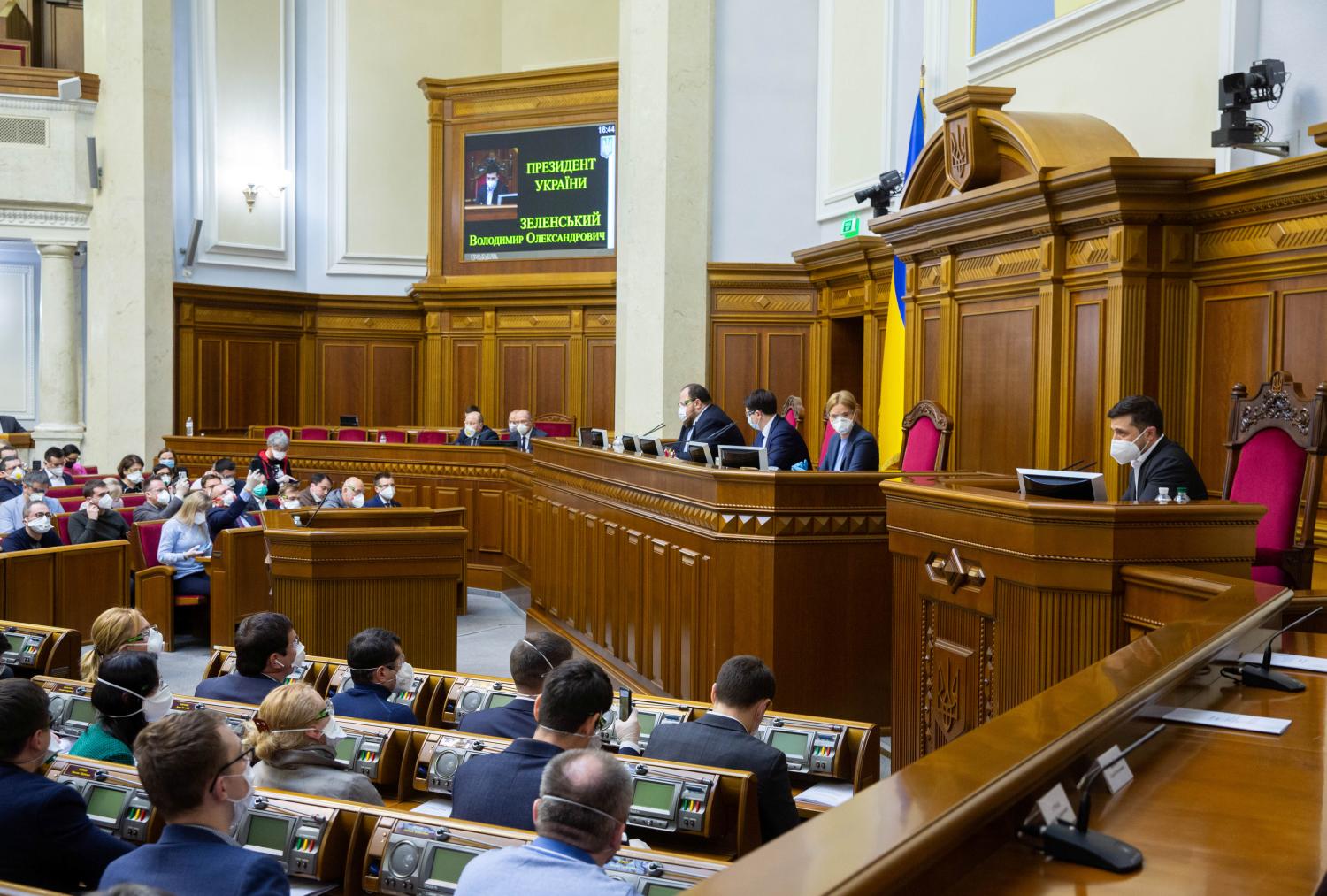 Ukrainian President Volodymyr Zelenskiy, wearing a protective mask used as a preventive measure against coronavirus disease (COVID-19), attends an emergency session of parliament in Kiev, Ukraine March 30, 2020. Ukrainian Presidential Press Service/Handout via REUTERS ATTENTION EDITORS - THIS IMAGE WAS PROVIDED BY A THIRD PARTY.