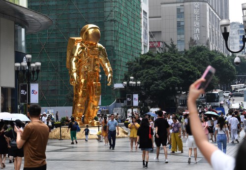 A huge sculpture featuring shape of an astronaut is displayed in celebration of 50th anniversary of Apollo 11 moon landing mission in Jiefangbei CBD, also known as Jiefangbei Commercial Walking Street, in Chongqing, China, 21 July 2019.No Use China. No Use France.