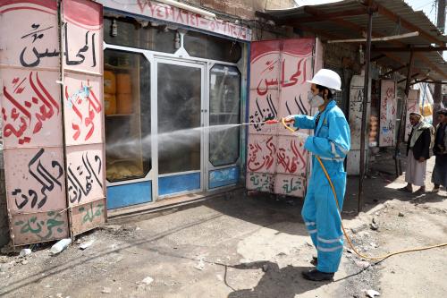 A health worker disinfects a market amid concerns of the spread of the coronavirus disease (COVID-19), on the outskirts of Sanaa, Yemen April 13, 2020. Picture taken April 13, 2020. REUTERS/Khaled Abdullah