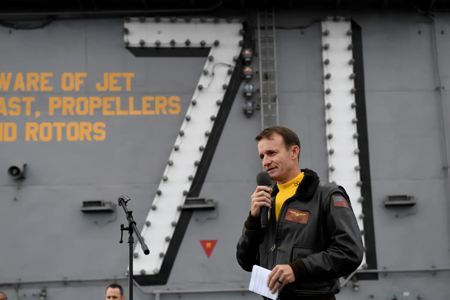 REFILE - CORRECTING YEAR Captain Brett Crozier, commanding officer of the U.S. Navy aircraft carrier USS Theodore Roosevelt, addresses the crew during an all-hands call on the ship’s flight deck in the eastern Pacific Ocean December 19, 2019. Picture taken December 19, 2019. U.S. Navy/Mass Communication Specialist 3rd Class Nicholas Huynh/Handout via REUTERS.  THIS IMAGE HAS BEEN SUPPLIED BY A THIRD PARTY.