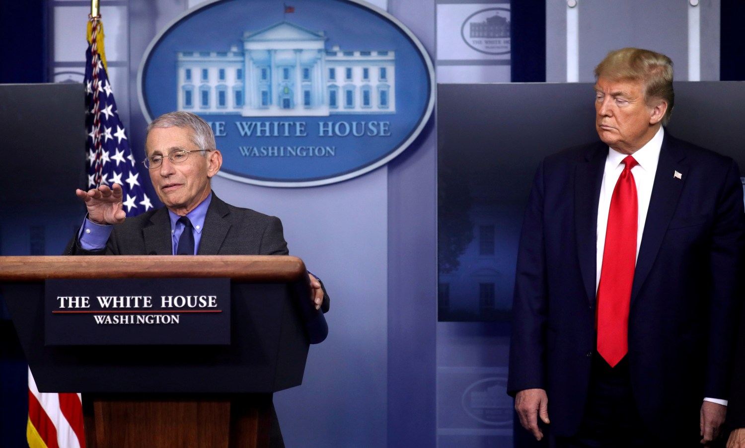 FILE PHOTO: National Institute of Allergy and Infectious Diseases director Dr. Anthony Fauci speaks as U.S. President Donald Trump listens during the daily coronavirus task force briefing at the White House in Washington, U.S., April 13, 2020. REUTERS/Leah Millis/File Photo