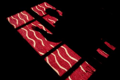 PARIS, FRANCE - APRIL 15: The shadow of a woman is cast on a carpet by the light coming through one of her windows during the confinement ordered by the French government to combat the coronavirus in France on April 15, 2020 in Paris, France.PARIS, FRANCE - 15 AVRIL L ombre d une femme est projetee sur un tapis par la lumiere passant par une de ses fenetres lors du confinement ordonne par le gouvernement francais pour lutter contre le coronavirus en France, le 15 avril 2020 a Paris, France.NO USE FRANCE