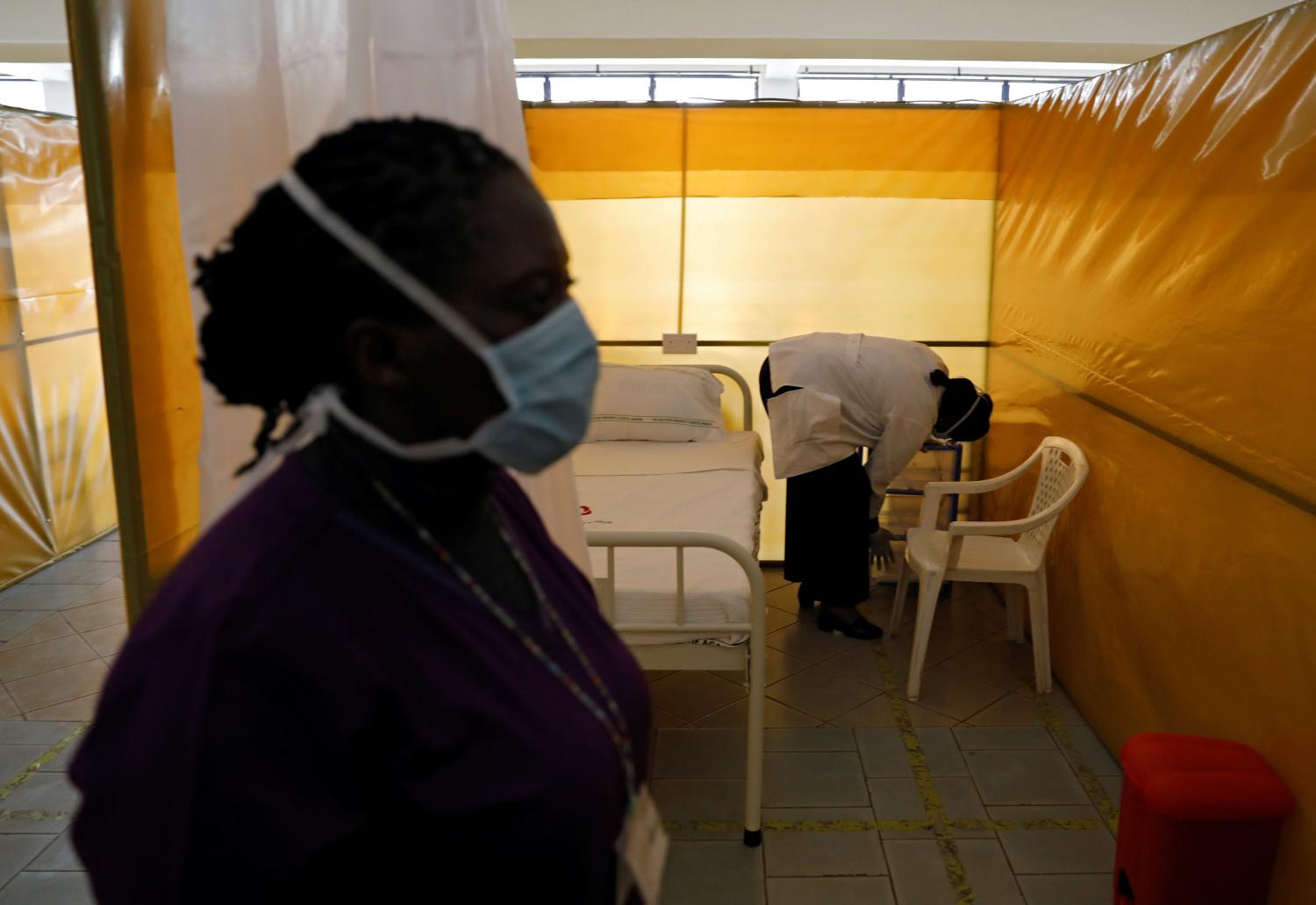 Medical staff members work at the yet to be used field hospital build to treat a large number of patients due to the spread of the coronavirus disease (COVID-19), at the Aga Khan University Hospital in Nairobi, Kenya, April 9, 2020. REUTERS/Baz Ratner