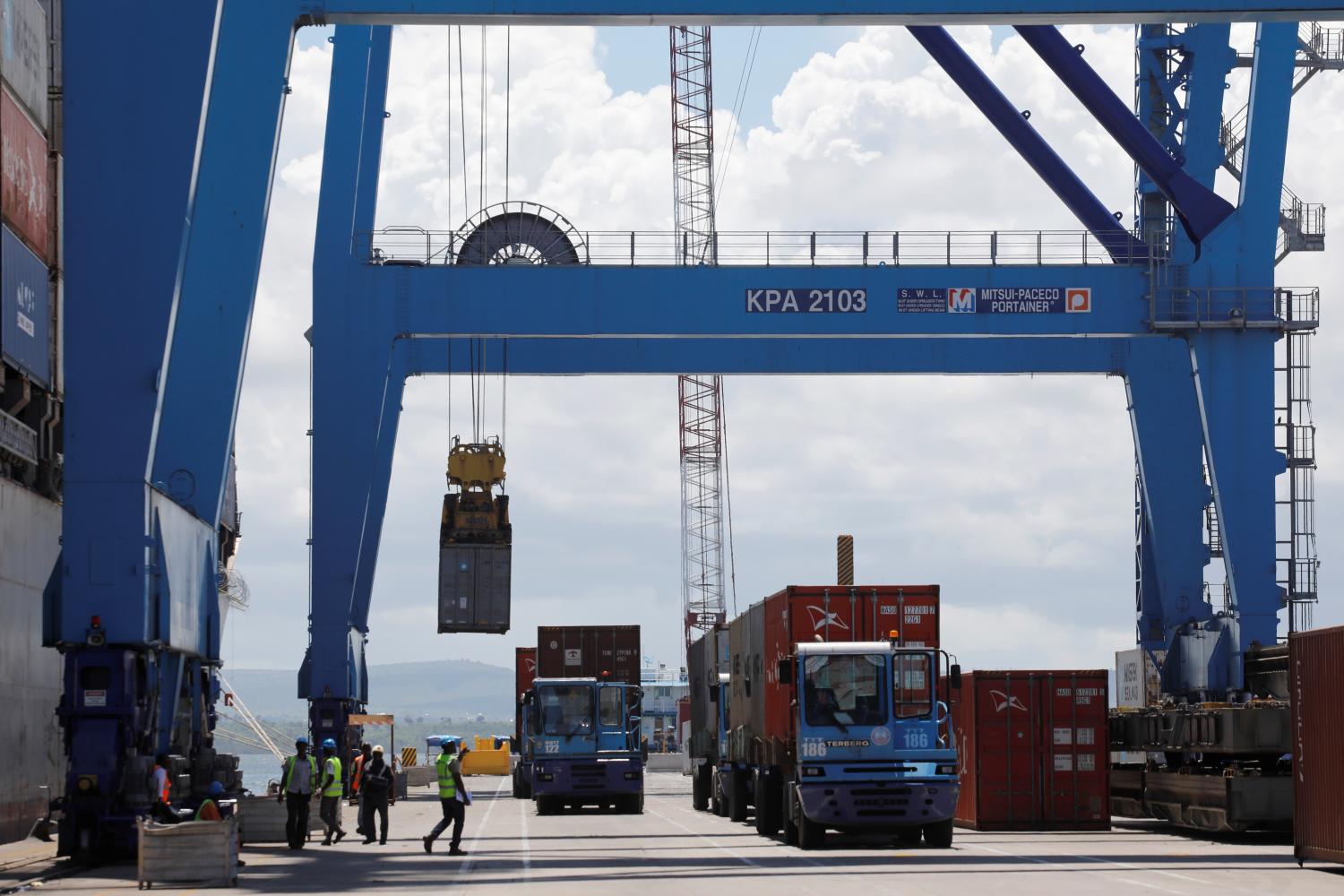 A crane loads shipping containers on a ship in the port of Mombasa, Kenya, October 23, 2019. Picture taken October 23, 2019. REUTERS/Baz Ratner