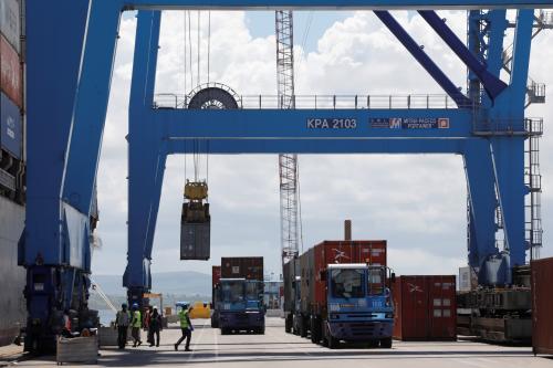 A crane loads shipping containers on a ship in the port of Mombasa, Kenya, October 23, 2019. Picture taken October 23, 2019. REUTERS/Baz Ratner
