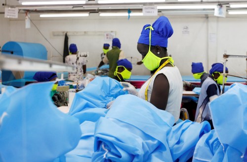 A worker is seen at a production line within the Shona Textiles Export Processing Zone (EPZ) as they make protective face masks and Personal Protective Equipment (PPE), as a measure to stem the coronavirus disease (COVID-19) outbreak, in Athi River near Nairobi, Kenya April 14, 2020. REUTERS/Njeri Mwangi