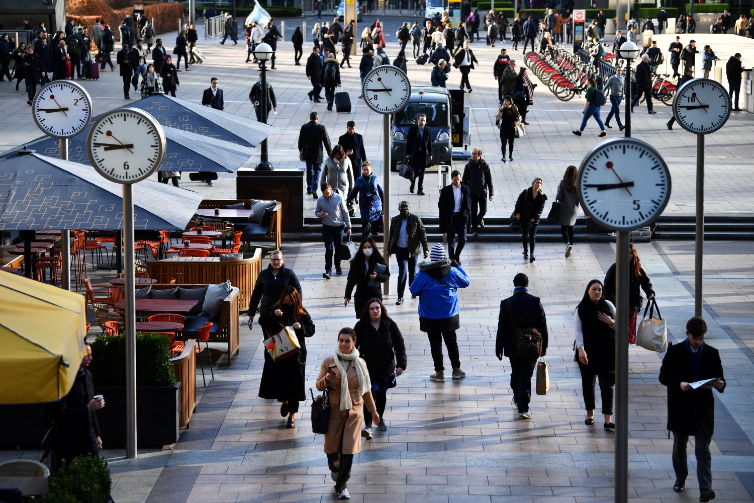 Commuters walk through Canary Wharf, as the number of coronavirus cases grow around the world and as European stocks plunge into bear market territory, in London, Britain March 9, 2020.  REUTERS/Dylan Martinez