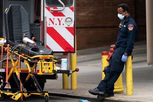 A healthcare worker takes a break outside Wyckoff Heights Medical Center during the outbreak of the coronavirus disease (COVID-19) in New York City, U.S., April 5, 2020. REUTERS/Jeenah Moon