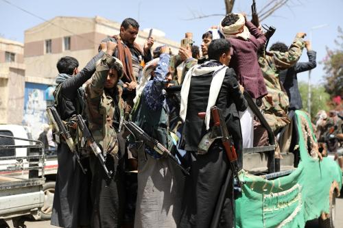 Armed Houthi followers ride on the back of a truck outside a hospital in Sanaa, Yemen April 8, 2020. Picture taken April 8, 2020. REUTERS/Khaled Abdullah