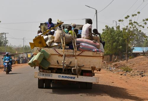 FILE PHOTO: Displaced people, who fled from attacks by armed militants in the town of Roffenega arrive on a truck in the city of Kaya near Pissila, Burkina Faso January 24, 2020. Picture taken January 24, 2020. REUTERS/Anne Mimault/File Photo