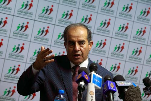 Mahmoud Jibril, head of the National Forces Alliance, talks during a news conference at his headquarters in Tripoli July 8, 2012. Jibril, the U.S.-trained consultant who abandoned the Gaddafi administration to become the face of the Libyan revolution, is positioning himself as a potentially unifying force as the country emerges from four decades of dictatorship. Picture taken July 8, 2012. To match Newsmaker LIBYA-ELECTIONS/JIBRIL     REUTERS/Zohra Bensemra (LIBYA - Tags: ELECTIONS POLITICS)