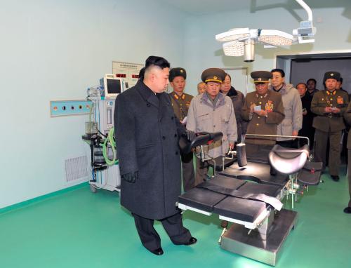 North Korean leader Kim Jong-Un (front) visits the Taesongsan General Hospital being built by the People's Army in this picture released by the North Korea's KCNA news agency in Pyongyang January 20, 2013. KCNA said the hospital covering a total plot of more than 100,000 square meters has three sick wards. KCNA did not state expressly the date when the picture was taken.  REUTERS/KCNA (NORTH KOREA - Tags: POLITICS) ATTENTION EDITORS - THIS PICTURE WAS PROVIDED BY A THIRD PARTY. REUTERS IS UNABLE TO INDEPENDENTLY VERIFY THE AUTHENTICITY, CONTENT, LOCATION OR DATE OF THIS IMAGE. FOR  EDITORIAL USE ONLY. NOT FOR SALE FOR MARKETING OR ADVERTISING CAMPAIGNS. THIS PICTURE IS DISTRIBUTED EXACTLY AS RECEIVED BY REUTERS, AS A SERVICE TO CLIENTS. NO THIRD PARTY SALES. NOT FOR USE BY REUTERS THIRD PARTY DISTRIBUTORS