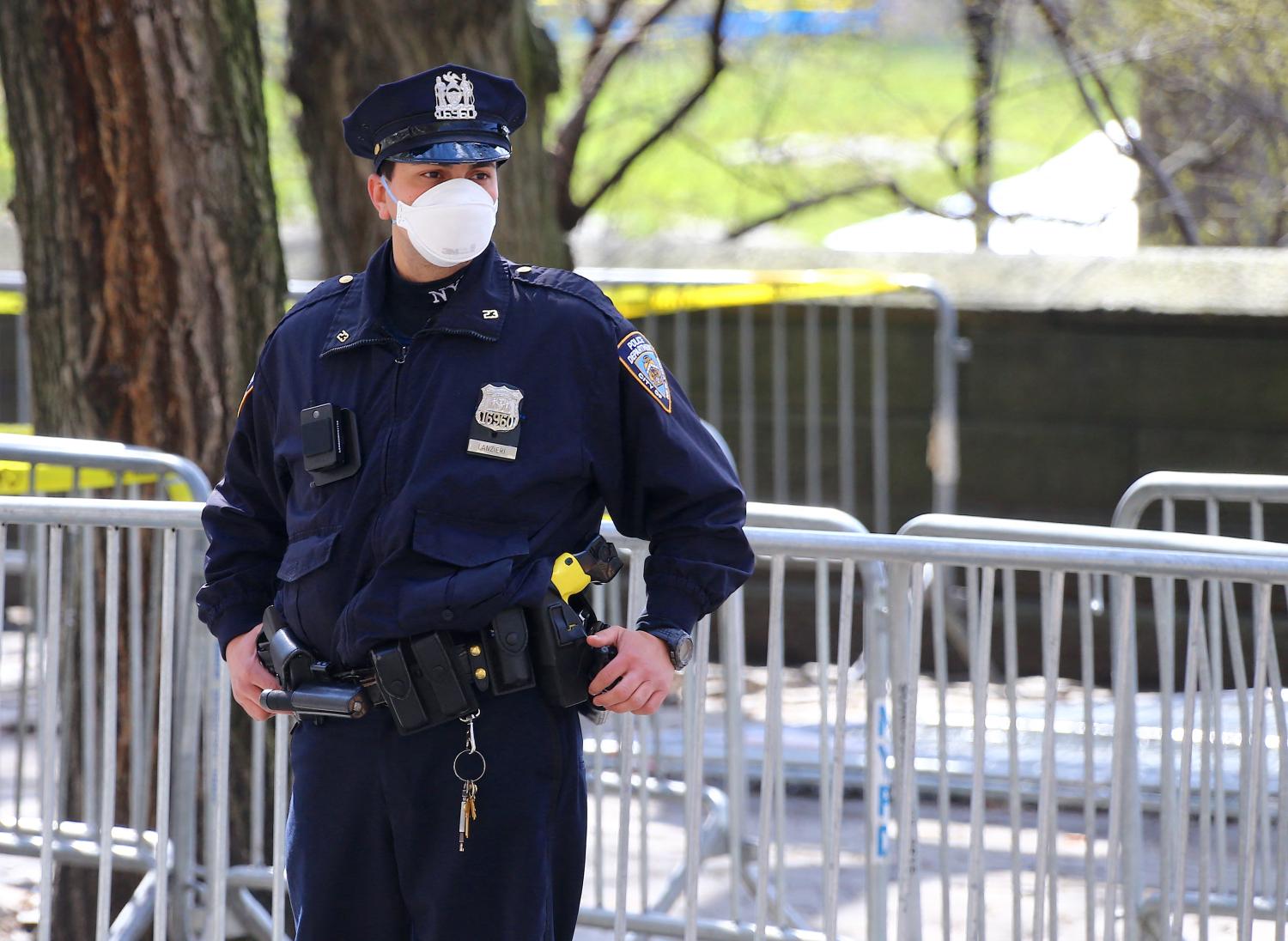 New York City Police officer with face mask on Fifth Avenue during the coronavirus pandemic in New York City, NY, USA on April 1, 2020. New York City has become the epicenter of coronavirus in the U.S with over 47,000 cases. The pandemic has forced millions of New Yorkers into their homes as local and state government enforce another 30 day stay-at-home order to try and flatten the curve. Photo by Charles Guerin/ABACAPRESS.COM