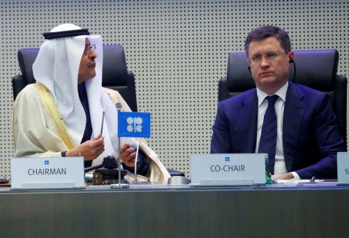 FILE PHOTO: Saudi Arabia's Minister of Energy Prince Abdulaziz bin Salman Al-Saud and Russia's Energy Minister Alexander Novak are seen at the beginning of an OPEC and NON-OPEC meeting in Vienna, Austria December 6, 2019. REUTERS/Leonhard Foeger/File Photo
