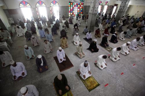 Muslims maintain safe distance as they attend Friday prayer after government limited congregational prayers and ordered to stay home, in efforts to stem the spread of the coronavirus disease (COVID-19), in Lahore, Pakistan April 24, 2020. REUTERS/Mohsin Raza