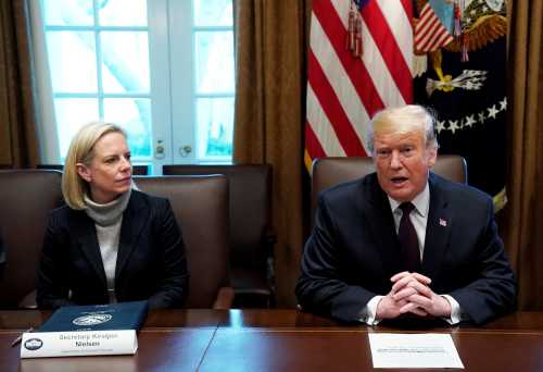 Department of Homeland Security (DHS) Secretary Kirstjen Nielsen listens as U.S. President Donald Trump leads a discussion on immigration proposals with conservative leaders in the Cabinet Room of the White House in Washington, U.S., January 23, 2019. REUTERS/Kevin Lamarque