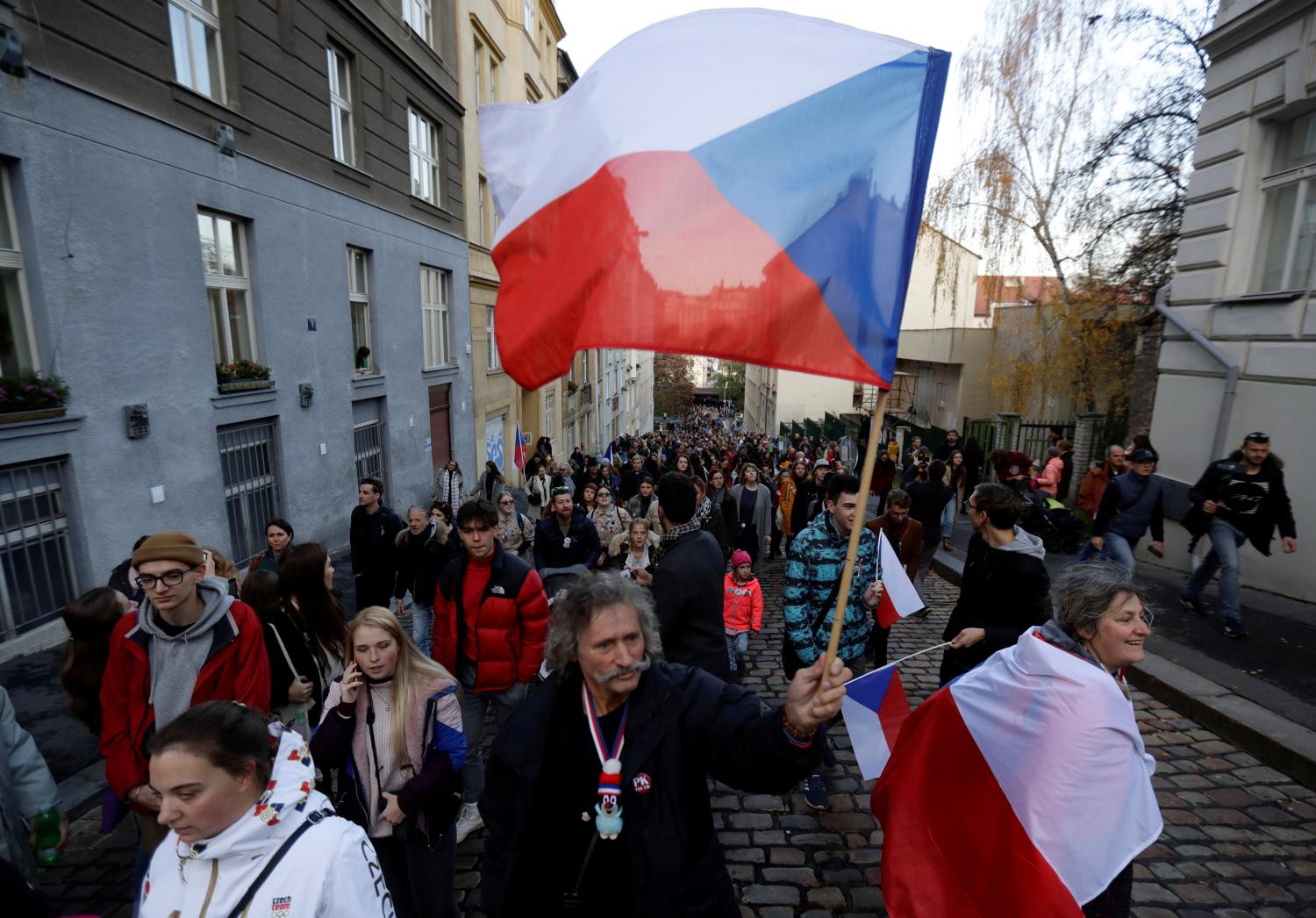 People attend a reenactment of the 1989 protest march to commemorate the 30th anniversary of the 1989 Velvet Revolution in Prague, Czech Republic, November 17, 2019. REUTERS/David W Cerny
