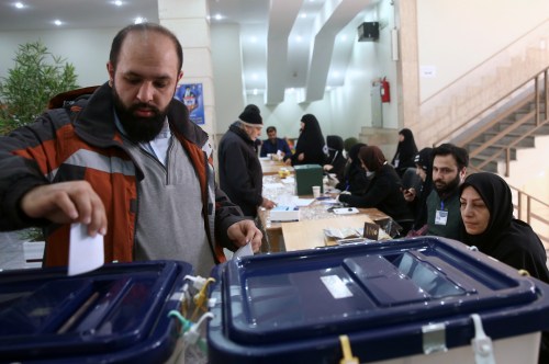 A man casts his vote during parliamentary elections at a polling station in Tehran, Iran February 21, 2020. Nazanin Tabatabaee/WANA (West Asia News Agency) via REUTERS ATTENTION EDITORS - THIS IMAGE HAS BEEN SUPPLIED BY A THIRD PARTY.