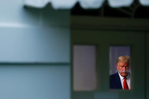 U.S. President Donald Trump participates in the daily coronavirus response briefing as seen through a window from outside of the White House press briefing room at the White House in Washington, U.S., March 31, 2020. REUTERS/Tom Brenner