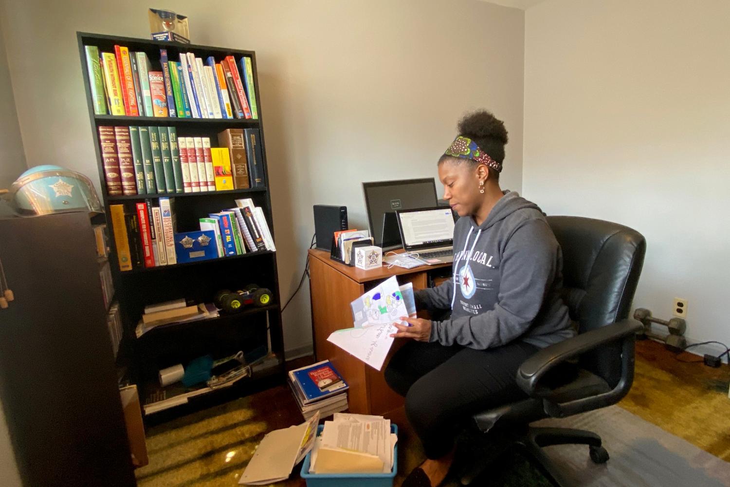 Middle school reading teacher Shayna Boyd prepares for the start of remote teaching due to coronavirus disease (COVID-19) restrictions in her home office in Chicago, Illinois, U.S. April 8, 2020. Picture taken April 8, 2020. REUTERS/Brendan O'Brien.