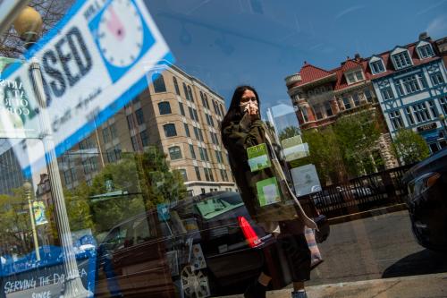 UNITED STATES - APRIL 17: A woman walks by the closed storefront of Copenhaver stationery store during the coronavirus outbreak on Connecticut Avenue in Dupont Circle on Friday, April 17, 2020. (Photo By Tom Williams/CQ Roll Call/Sipa USA)No Use UK. No Use Germany.