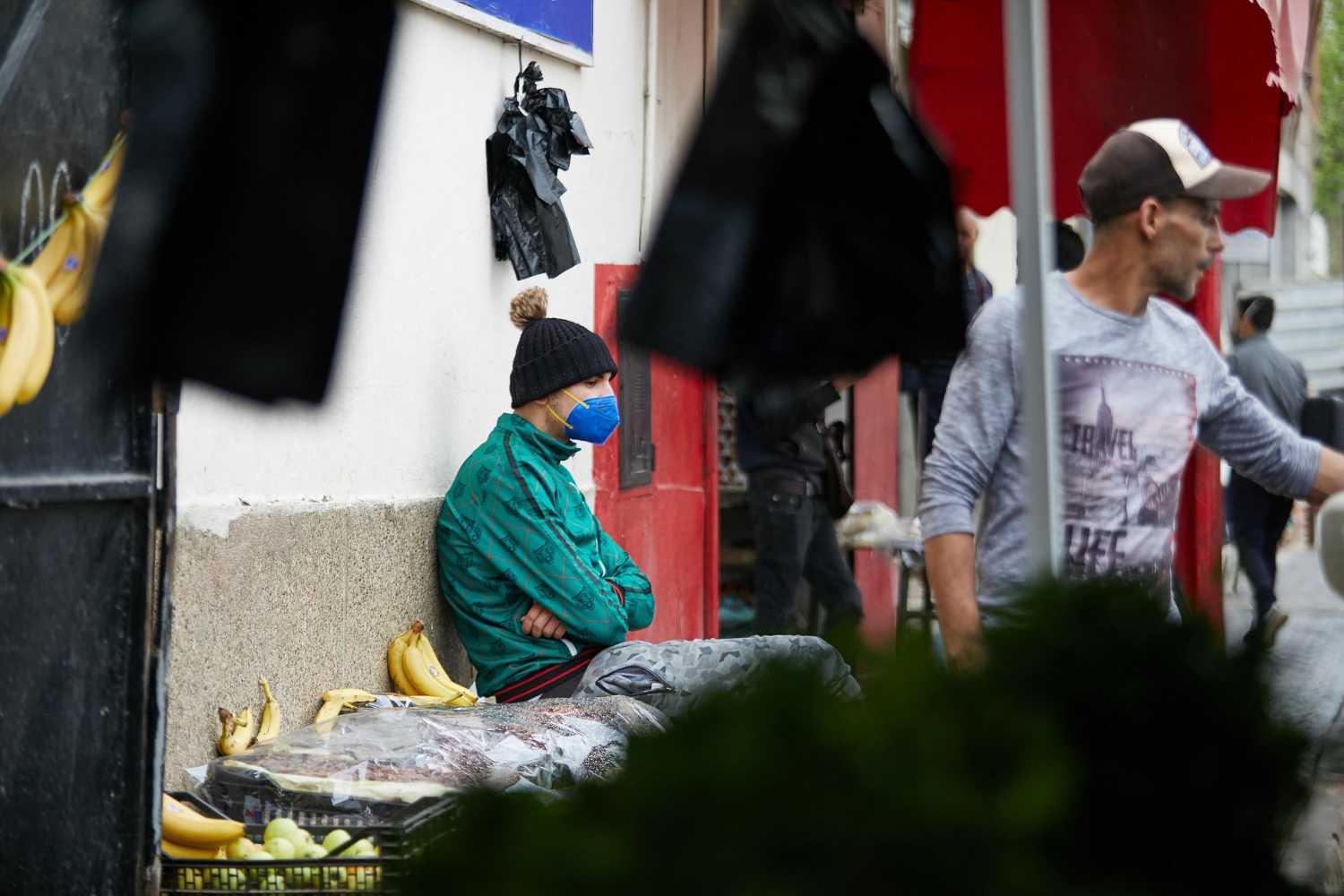 A vendor wearing a protective face mask serves a customer in his shop, during the Muslim holy month of Ramadan, amid concerns over the coronavirus disease (COVID-19), in Boufarik, wilaya of Blida in Algeria, April 25, 2020. Algeria has taken further steps to ease restrictions over the novel coronavirus by allowing several businesses to reopen "to reduce the economic and social impact of the health crisis" caused by the pandemic, the prime minister's office said on Saturday. Photo by Louiza Ammi/ABACAPRESS.COM
