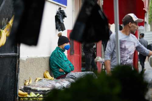 A vendor wearing a protective face mask serves a customer in his shop, during the Muslim holy month of Ramadan, amid concerns over the coronavirus disease (COVID-19), in Boufarik, wilaya of Blida in Algeria, April 25, 2020. Algeria has taken further steps to ease restrictions over the novel coronavirus by allowing several businesses to reopen "to reduce the economic and social impact of the health crisis" caused by the pandemic, the prime minister's office said on Saturday. Photo by Louiza Ammi/ABACAPRESS.COM