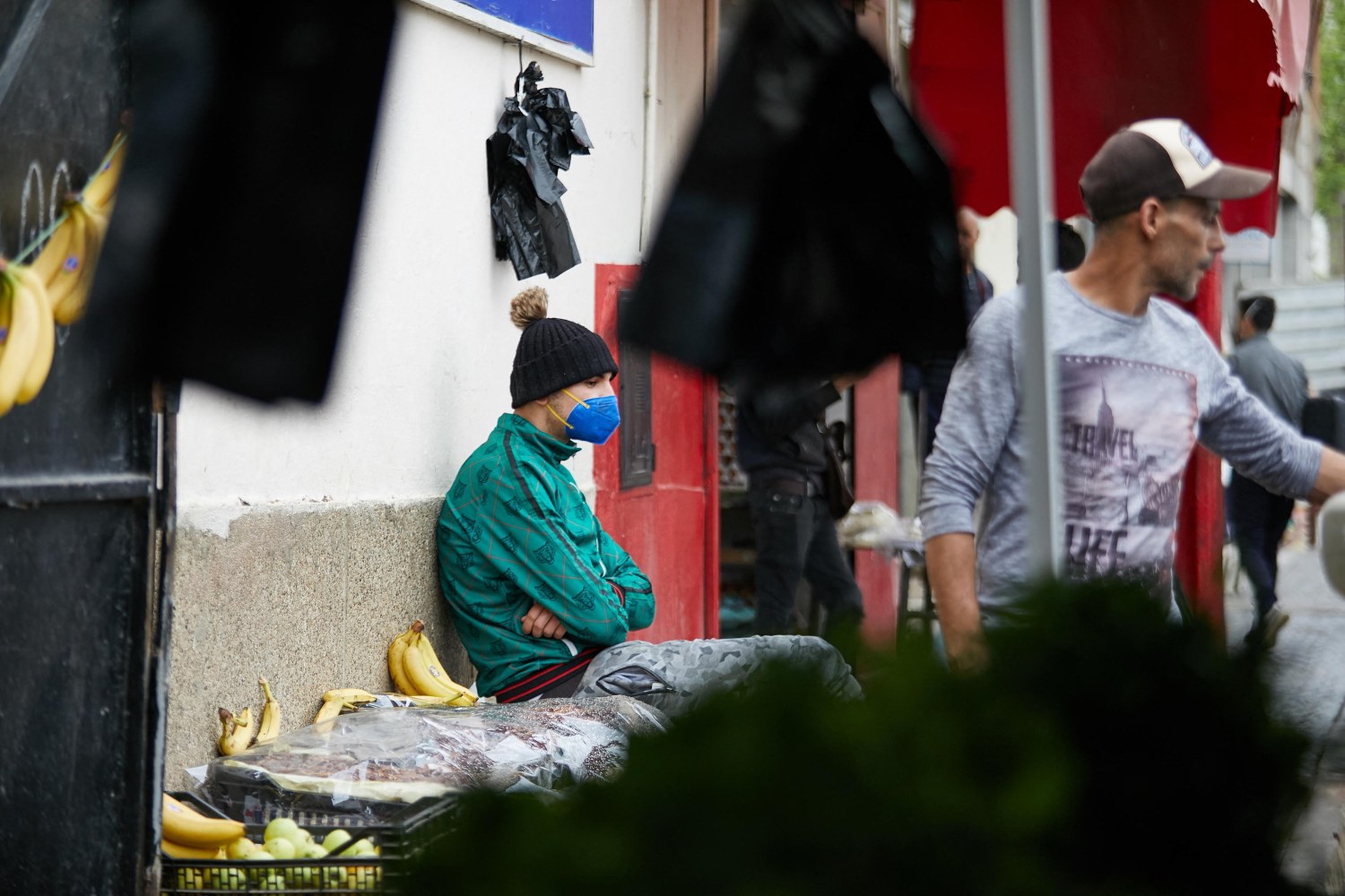 A vendor wearing a protective face mask serves a customer in his shop, during the Muslim holy month of Ramadan, amid concerns over the coronavirus disease (COVID-19), in Boufarik, wilaya of Blida in Algeria, April 25, 2020. Algeria has taken further steps to ease restrictions over the novel coronavirus by allowing several businesses to reopen "to reduce the economic and social impact of the health crisis" caused by the pandemic, the prime minister's office said on Saturday. Photo by Louiza Ammi/ABACAPRESS.COM