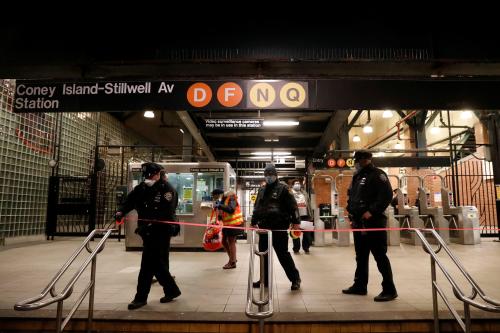 New York City Police Department (NYPD) officers tape up an entrance as the MTA Subway closed overnight for cleaning and disinfecting during the outbreak of the coronavirus disease (COVID-19) in the Brooklyn borough of New York City, U.S., May 7, 2020. REUTERS/Andrew Kelly