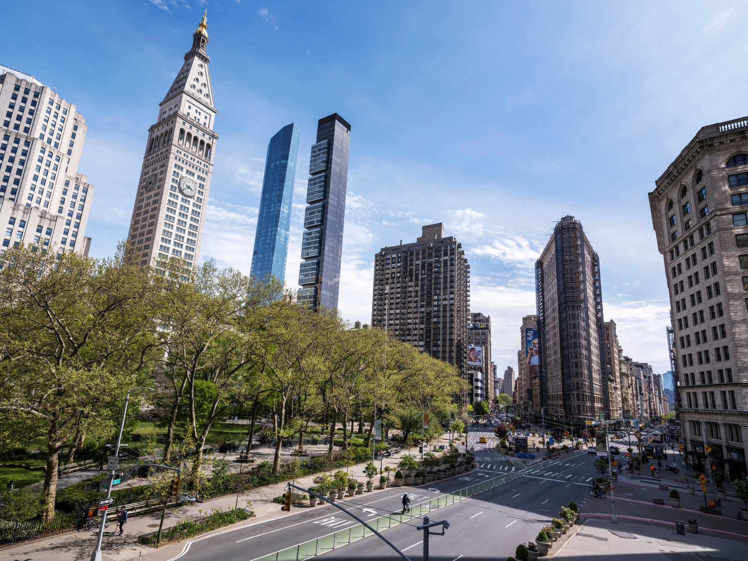 FILE PHOTO: The Flatiron Building stands next to Madison Square Park as streets remain less busy due to the continuing outbreak of the coronavirus disease (COVID-19) in the Manhattan borough of New York U.S., May 5, 2020. Picture taken May 5, 2020 at 3:38PM. REUTERS/Lucas Jackson/File Photo