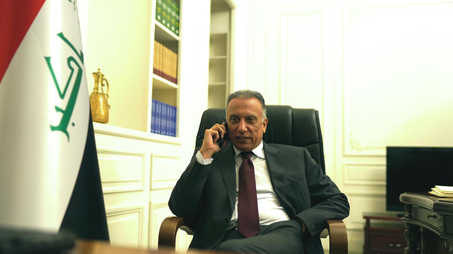 Iraqi Prime Minister Mustafa al-Kadhimi uses his mobile phone at his office in Baghdad, Iraq May 9, 2020. Picture taken May 9, 2020. Iraqi Prime Minister Media Office/Handout via REUTERS ATTENTION EDITORS - THIS IMAGE WAS PROVIDED BY A THIRD PARTY.