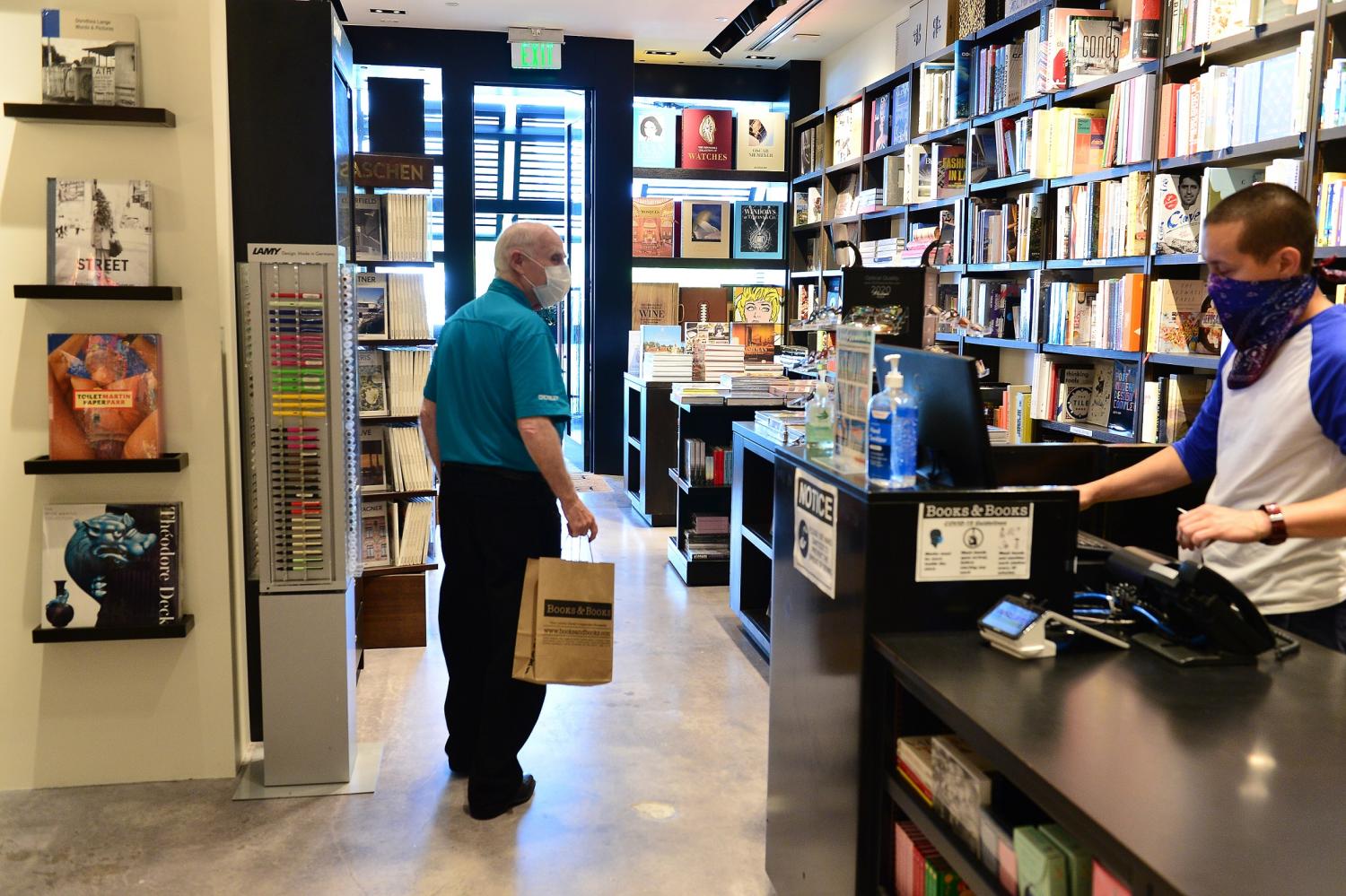 BAL HARBOUR, FL - MAY 23: Independent book store Books&Books finally re-open one of their store at the Bal Harbour shop after two month closing due amid of reducing the out spread of Covid-19 coronavirus pandemic. Sign posted all over the store urge customer to wear mask and staff provided hand sanitizer upon enter the store to customer on May 23, 2020 in Bal Harbour, Florida.  Miami-Dade County, Florida start Phase one re-opening after two month of stay at home order was place by (R) FL Gov. Ron DeSanti   (Photo by JL/Sipa USA)No Use UK. No Use Germany.