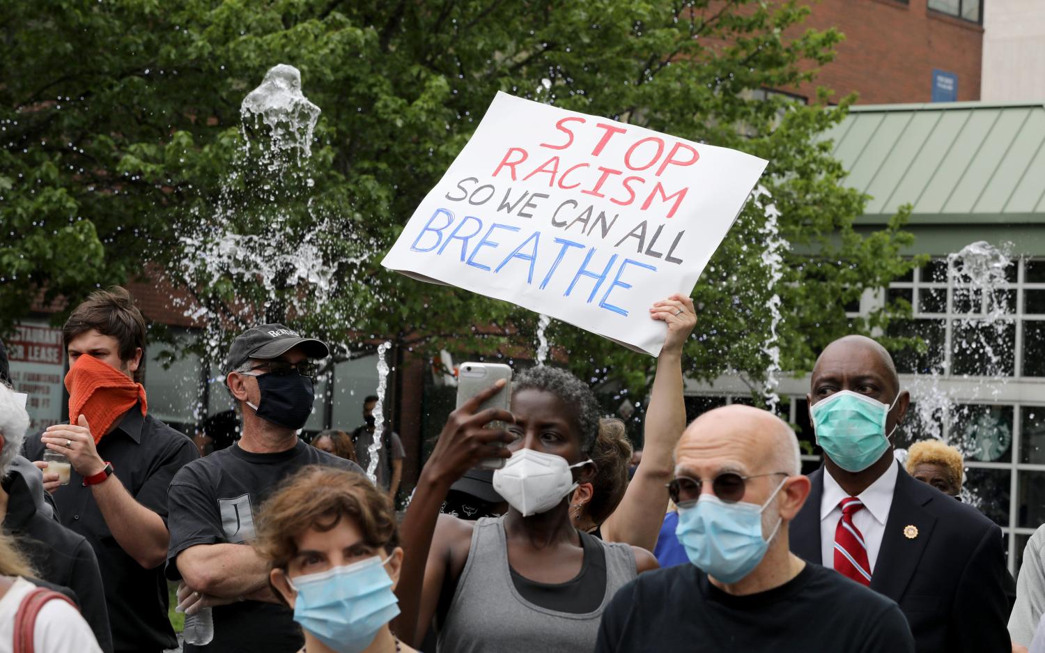 Debra and Willie Sanchez from White Plains hold a sign in front of the fountain spray, as a vigil for George Floyd was held at the Renaissance Plaza in White Plains, May 29, 2020. The event was organized by WESPAC and featured a moment of silence, prayers and speeches by attendees.JUMP George Floyd White Plains