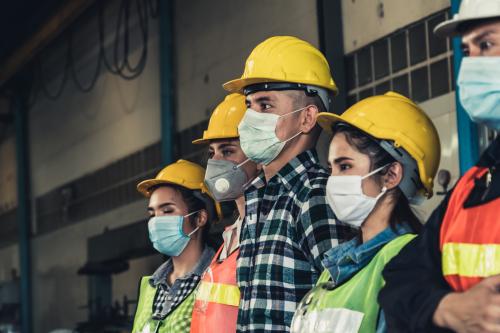 Workers wearing masks