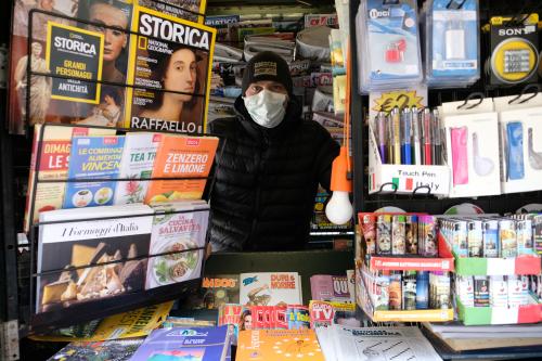 Newspapers stand worker wearing a proctective mask is seen after Italy tightened the lockdown measures to combat the coronavirus disease (COVID-19) outbreak in Venice, Italy, March 22, 2020. REUTERS/Manuel Silvestri