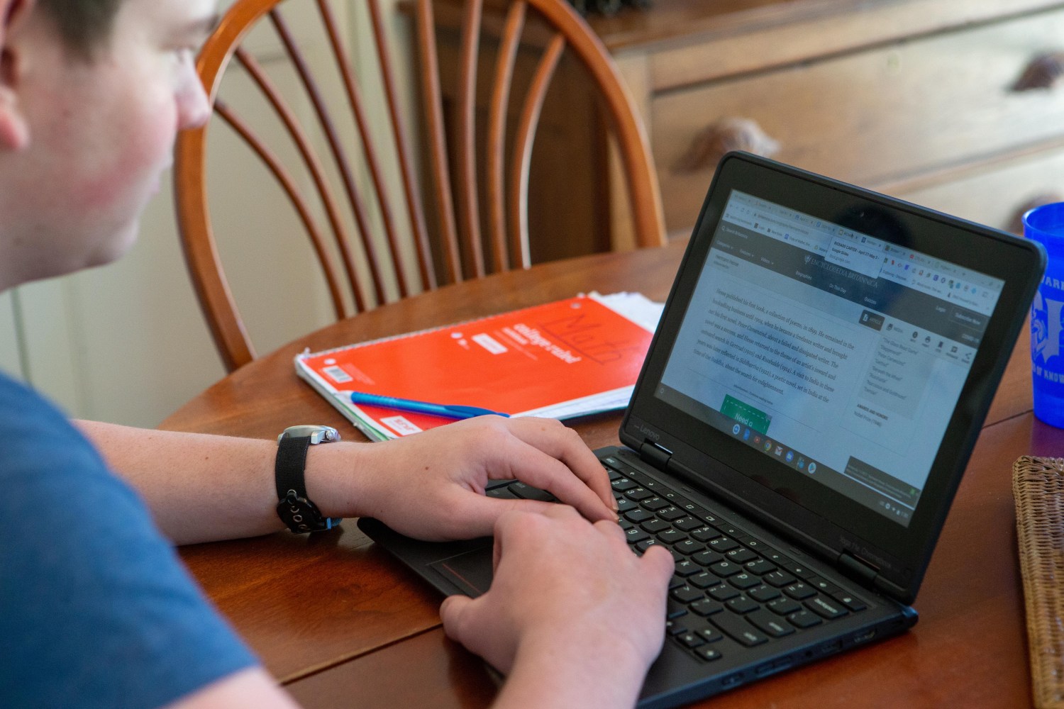 May 12, 2020, Topeka, KS, USA; Using his laptop, Trip Carter, a sophomore at Topeka High, works on school work virtually at his home Mandatory Credit: Evert Nelson/The Capital-Journal via USA Today Network