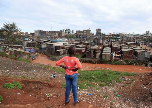 A child looks at the Mathare Valley slums amid the spread of the coronavirus disease (COVID-19) in Nairobi, Kenya April 19, 2020. REUTERS/Thomas Mukoya