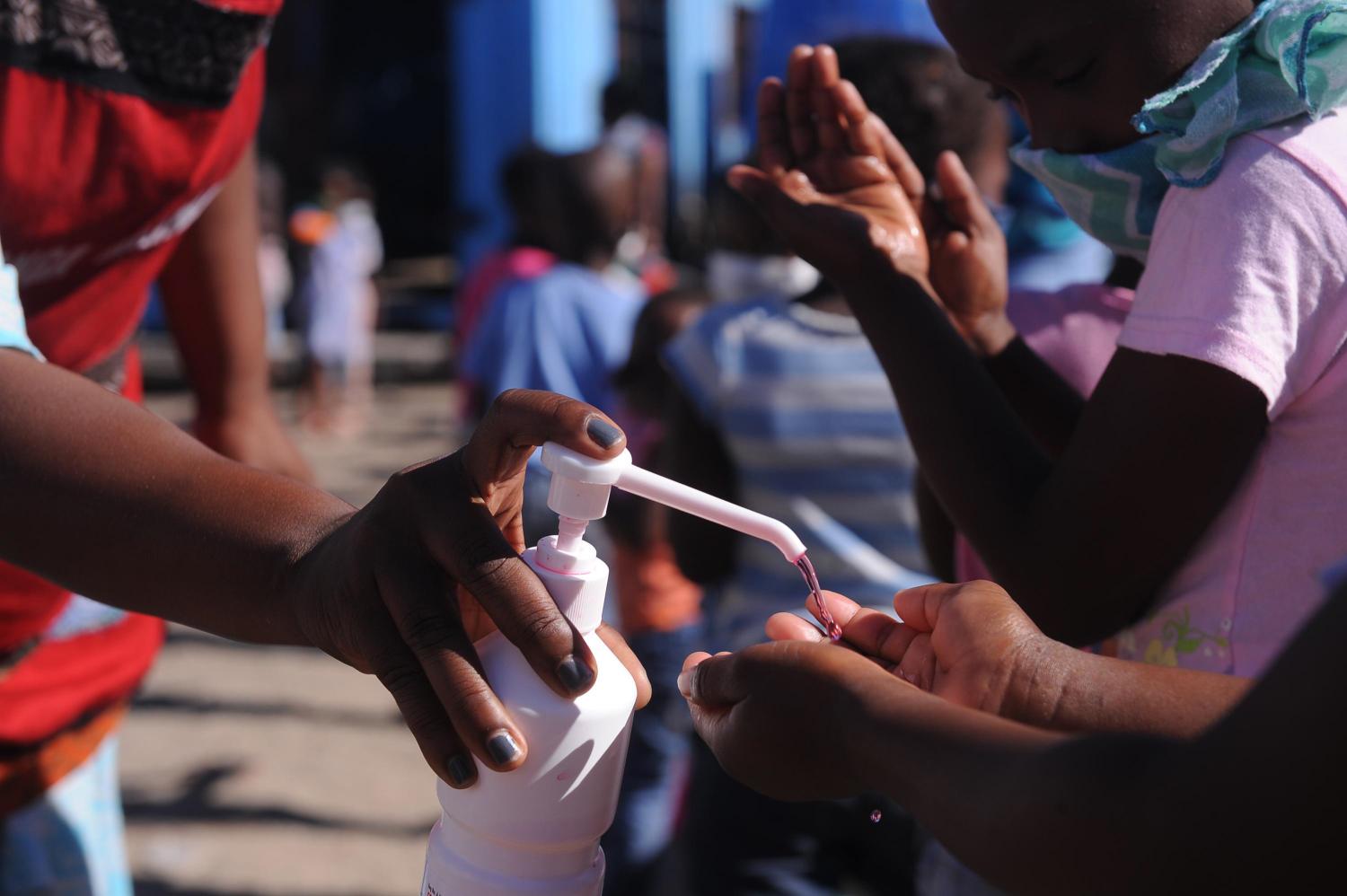 CAPE TOWN, SOUTH AFRICA- Children wait in line to eat amid the coronavirus crisis in Cape Town, South Africa on April 30, 2020. Entrepreneurs and foundations have teamed up to feed children in the area. Approximately 300 children are fed daily since the onset of the coronavirus quarantine. (NO RESALE)