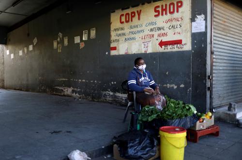 A vegetables seller waits for customers at Bara taxi rank, during a nationwide lockdown, aimed at limiting the spread of the coronavirus disease (COVID-19), in Soweto, South Africa, April 23,2020. REUTERS/Siphiwe Sibeko