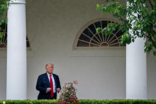 U.S. President Donald Trump adjusts his jacket while standing in the Colonnade of the White House after a Rolling to Remember ceremony honoring the nations veterans and prisoners of war/missing in action (POW/MIA) in Washington, D.C., U.S., on Friday, May 22, 2020. Trump didn't wear a face mask during most of his tour of Ford Motor Co.'s ventilator facility Thursday, defying the automaker's policies and seeking to portray an image of normalcy even as American coronavirus deaths approach 100,000. Photographer: Andrew Harrer/Pool/Sipa USA No Use UK. No Use Germany.