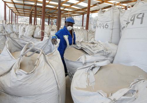 A worker is seen sampling packaged phosphate at a packing warehouse at the Dorowa mine in Hwedza, Zimbabwe October 22, 2019. REUTERS/Philimon Bulawayo